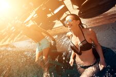 Young Happy Couple Is Resting Under Sun In Swimming Pool At Summer Time. Royalty Free Stock Images Young Happy Couple Is Resting Under Sun In Swimming Pool At Summer Time. Royalty Free Stock Images
