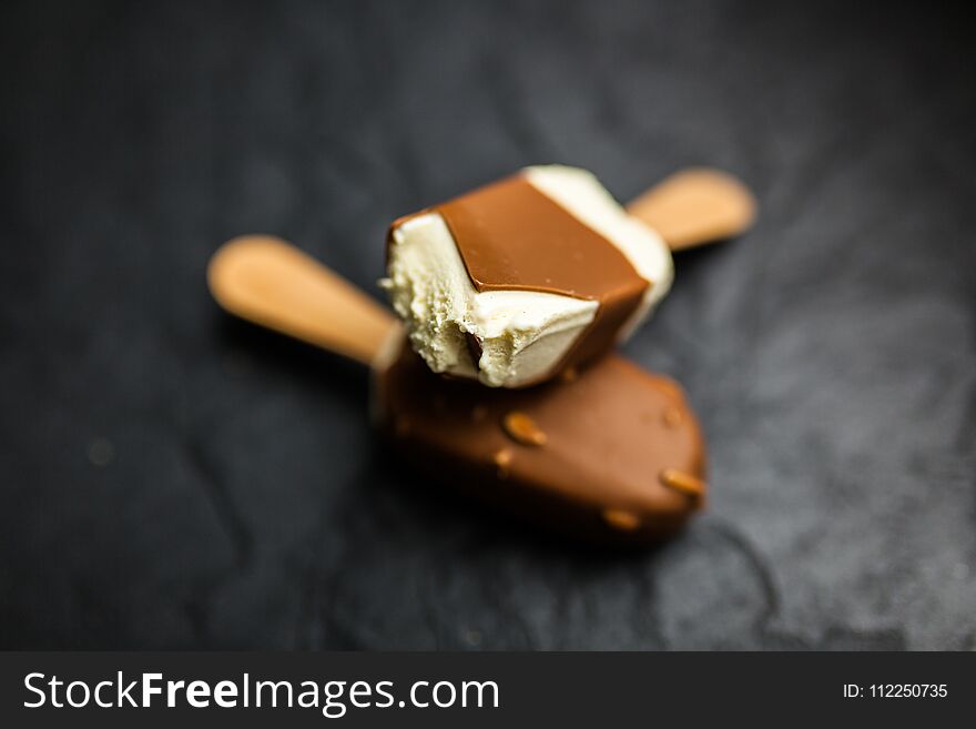 Ice cream on a stick on dark slate background