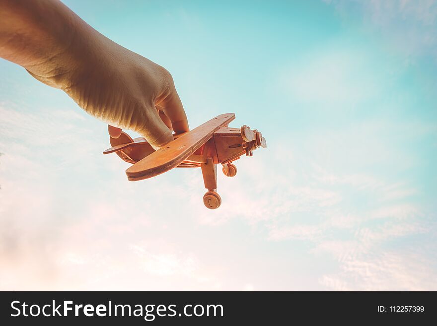Toy Airplane In Hand