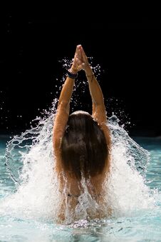 Young Beautiful Woman Making Water Splash At The Pool Stock Images
