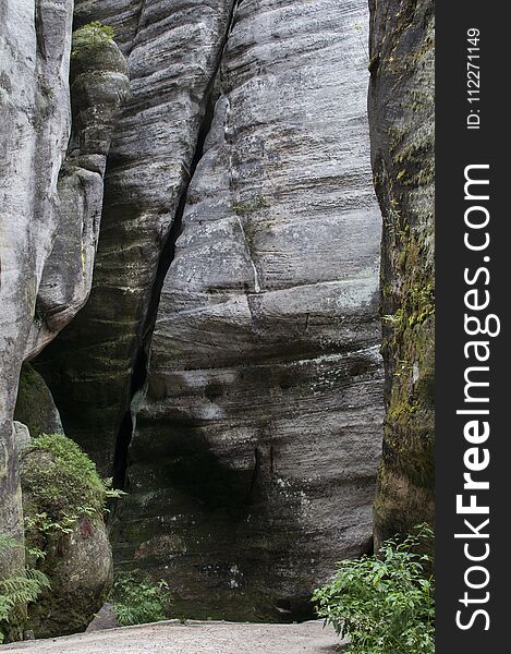 The narrow path among high rocks Adrspach Rock City during summer