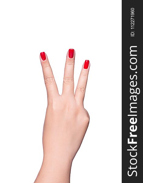 Female hand showing the gesture with three fingers is isolated on white background