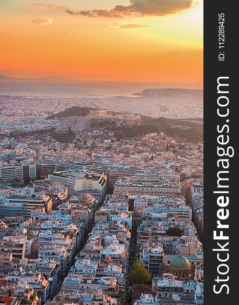 Cityscape of Athens with Acorpolis hill and sea in sunset light, Greecer. Cityscape of Athens with Acorpolis hill and sea in sunset light, Greecer