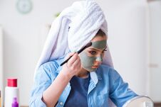 The Woman Applying Clay Mask With Brush At Home Royalty Free Stock Images