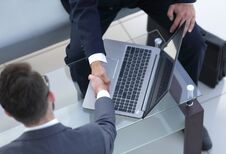 Handshake Business People In The Workplace. Royalty Free Stock Images