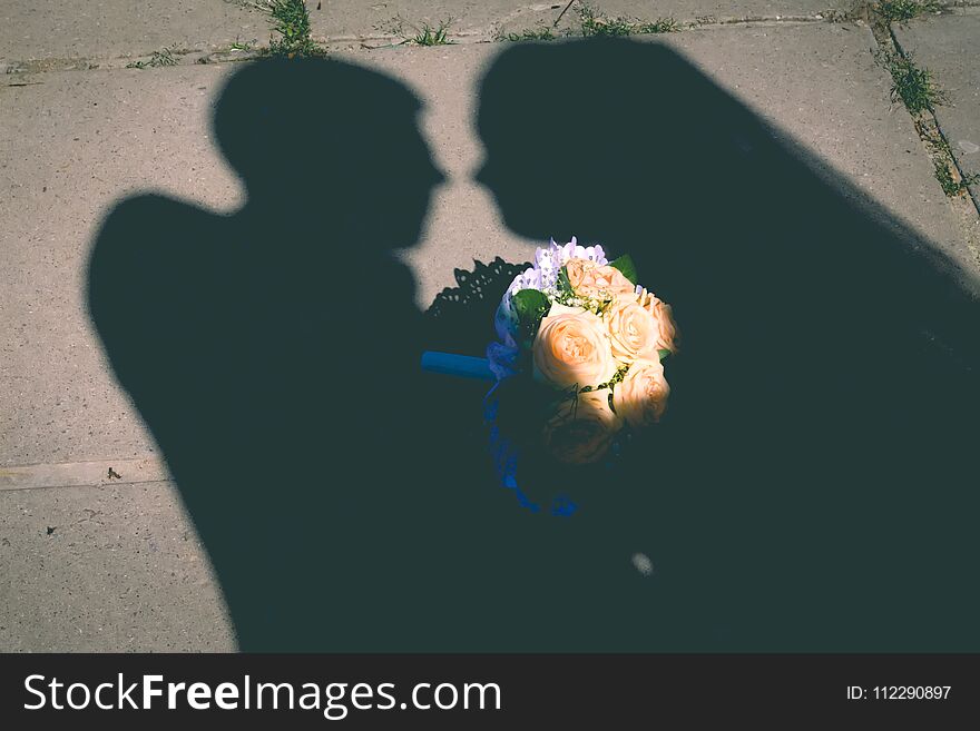 Young wedding couple enjoying romantic moments outside on a summer meadow, bouquet, woman, day