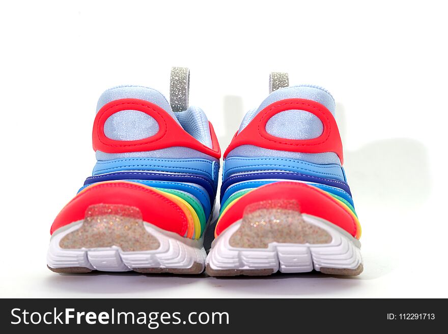 Colourful running shoes on white background,front view ,on floor, clear