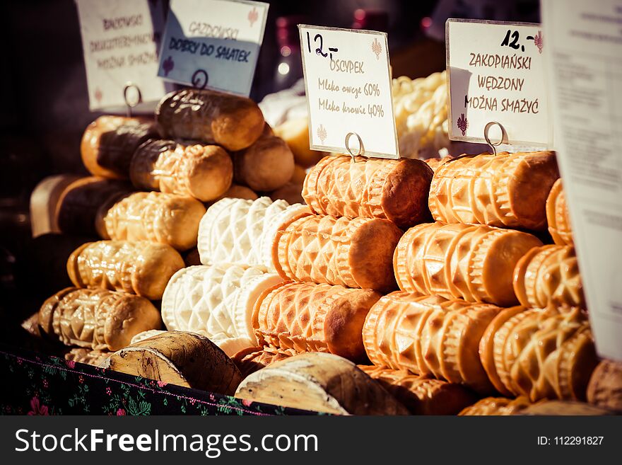 Traditional polish smoked cheese oscypek on outdoor market in Zakopane