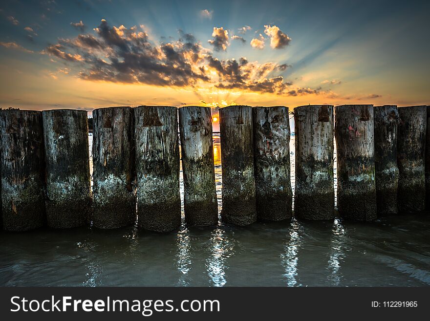 Sunset On Beach With A Wooden Breakwater In Leba, Baltic Sea, Po