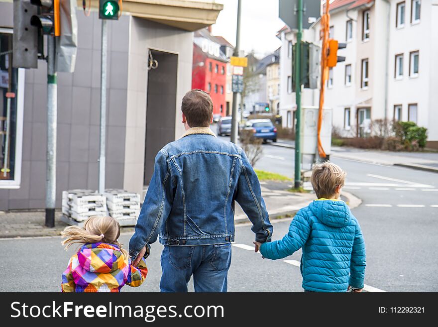 Father Being An Everyday Superhero Guiding And Helping Son And Daughter