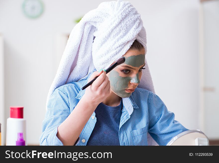 The Woman Applying Clay Mask With Brush At Home