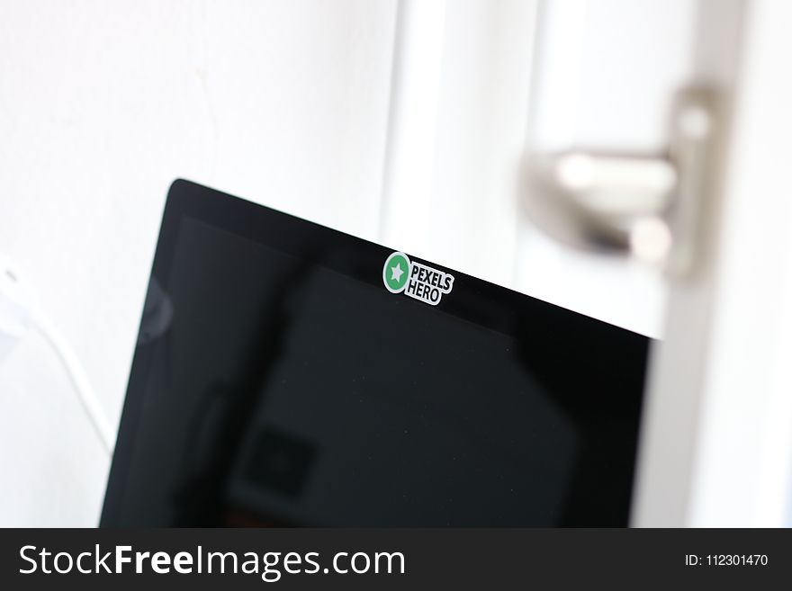 Closeup Photo of Opened Black Laptop Computer With Pexels Hero Sticker
