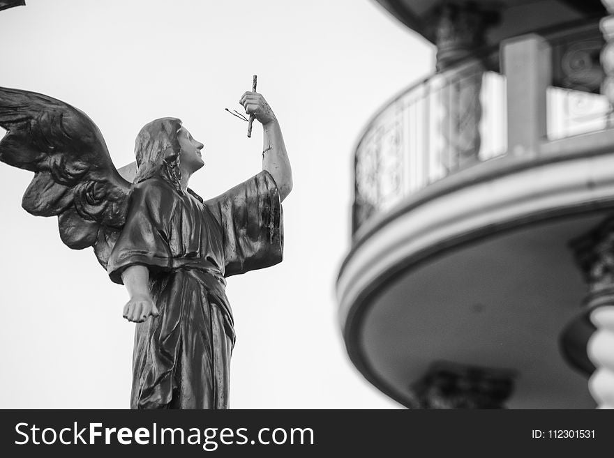 Shallow Focus Architectural Photography of Angel Statue