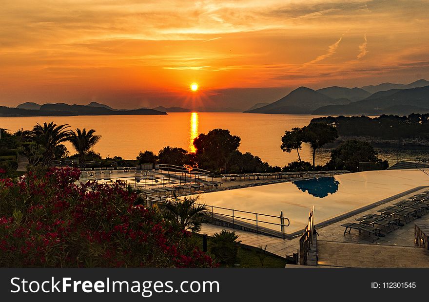 Aerial Photography of Swimming Pool during Sunset