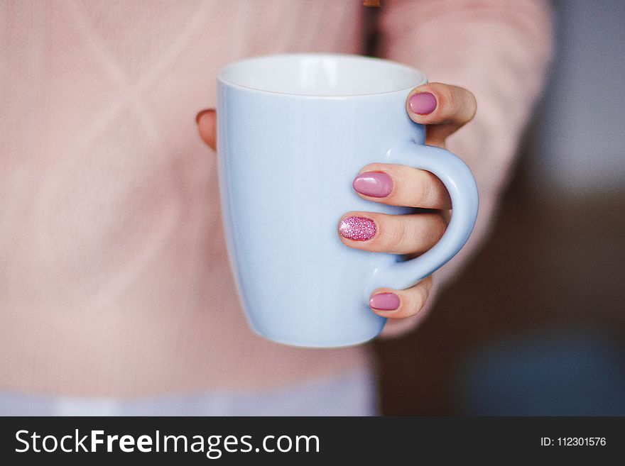 Person Holding White Ceramic Mug