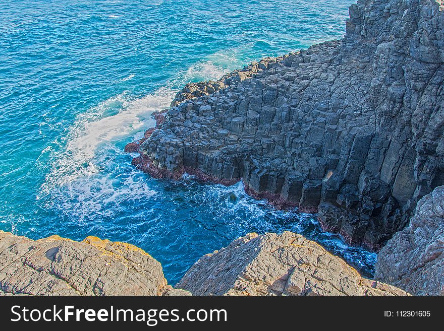 Grey Rock Formation Near Water