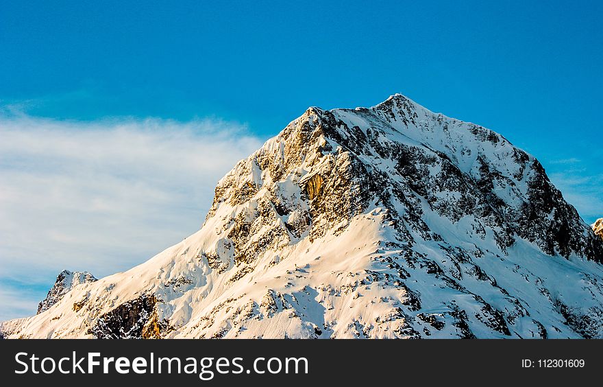 Snow Covered Mountain Under Clear Blue Sky