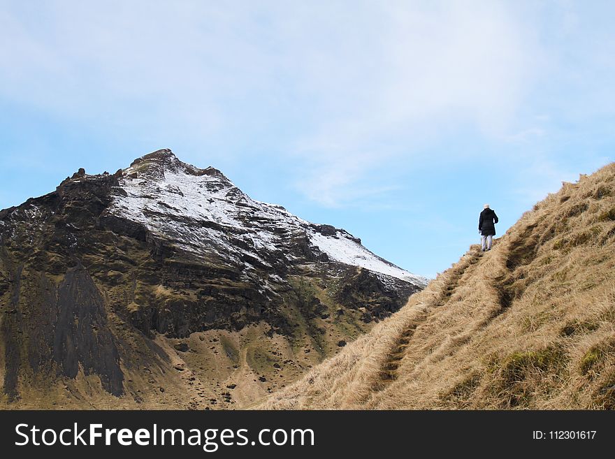 Person Climb on Mountain