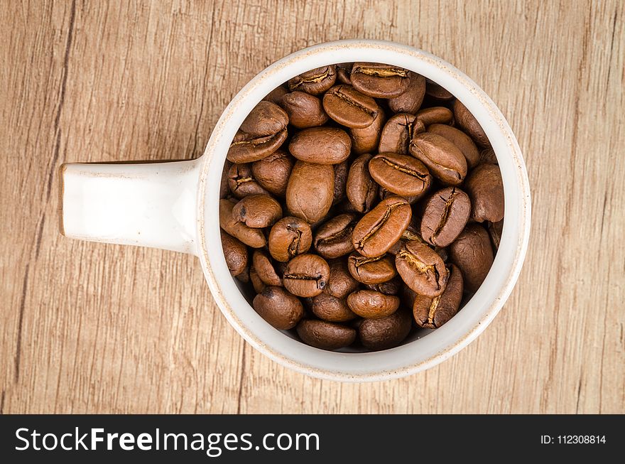 Roasted Coffee Beans Inside White Ceramic Mug