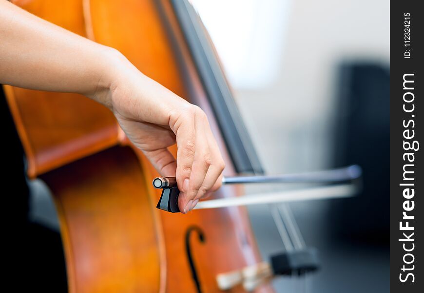 Close Up Of Cello With Bow In Hands