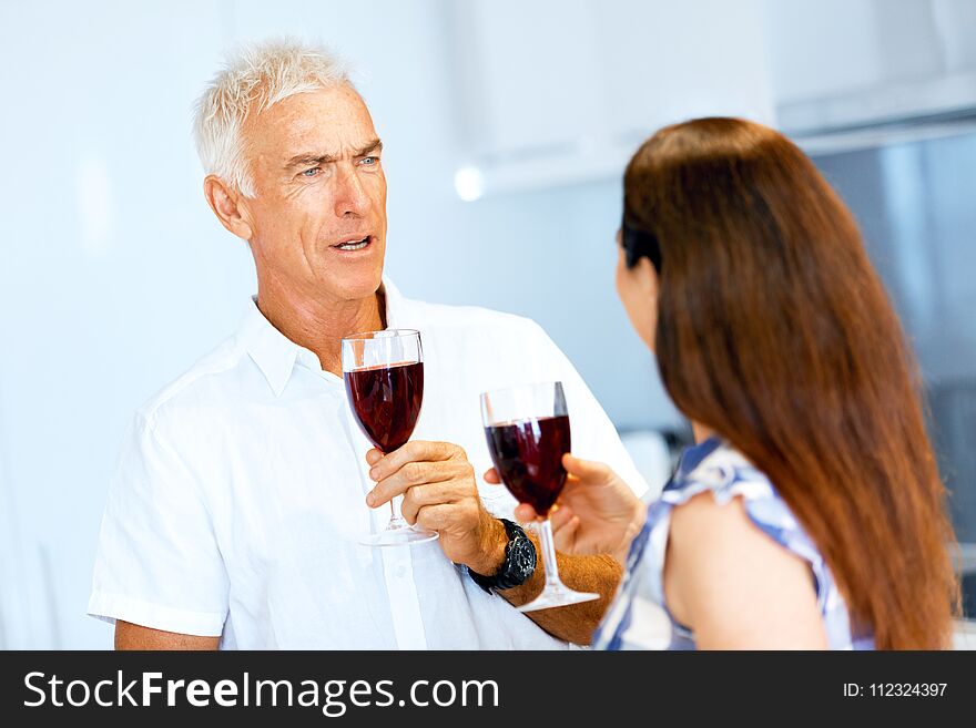 Portrait Of A Couple Having A Glass Of Red Wine