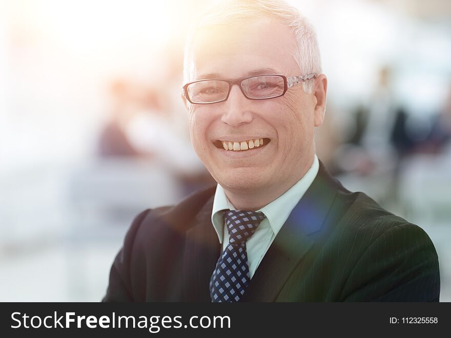 Close up portrait of senior businessman in office. photo with copy space.