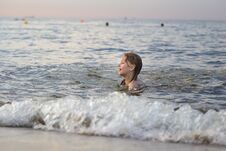 Girl Swimming In The Sea Stock Photo