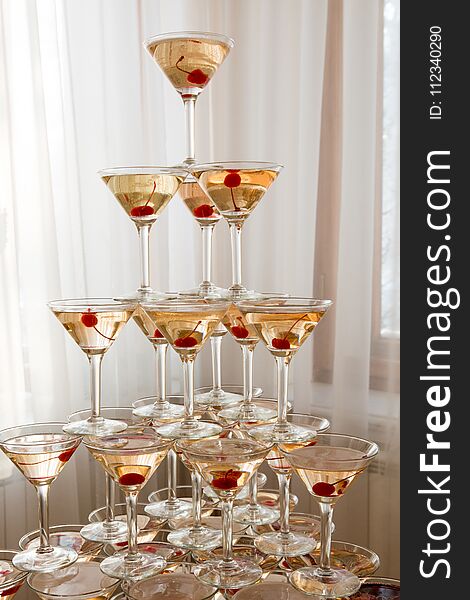 A slide of sparkling wine glasses at the wedding ceremony for the bride and groom and guests. A slide of sparkling wine glasses at the wedding ceremony for the bride and groom and guests.