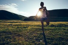 Runner Warming Up On Sunset Grassland Trail Stock Image