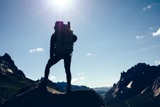 Woman With Backpack Hiking On Sunrise Mountain Top Royalty Free Stock Images