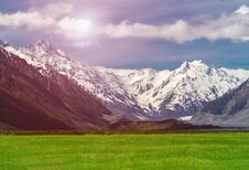 Mountain Ranges And Green Grass Field Landscape Royalty Free Stock Photo Mountain Ranges And Green Grass Field Landscape Royalty Free Stock Photo