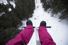Legs On Cable Car Over The Mountains In Ski Resort Royalty Free Stock Photos