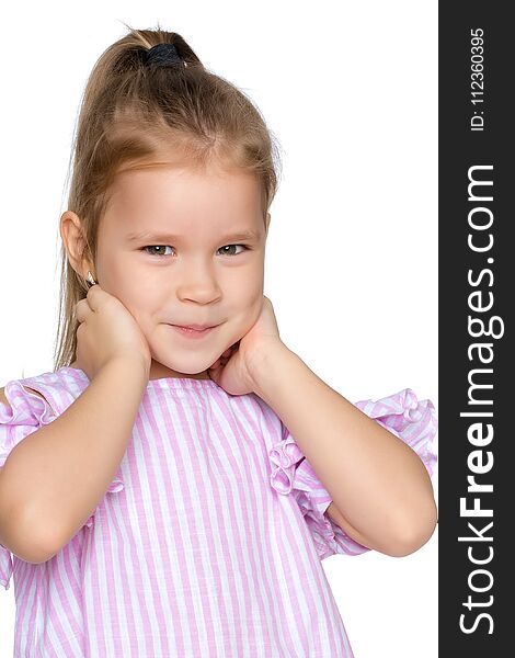 A nice little girl thinks. The concept of education and school, children`s creativity. Isolated on white background. A nice little girl thinks. The concept of education and school, children`s creativity. Isolated on white background.