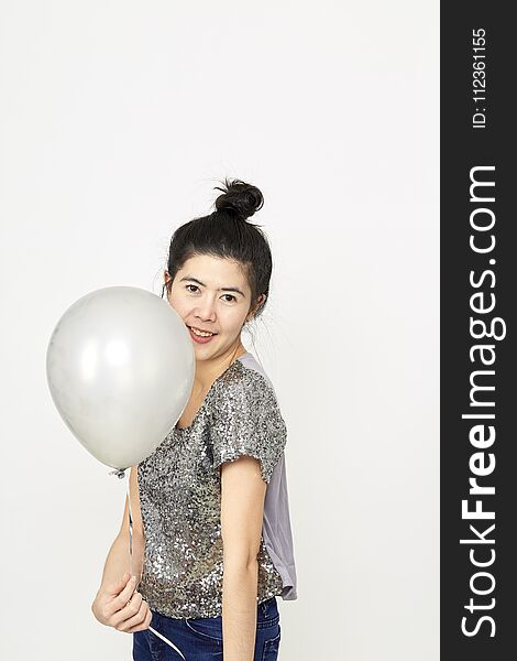Beautiful Asian Woman with colorful balloons in the Studio noon light , summer holidays, celebration and lifestyle concept