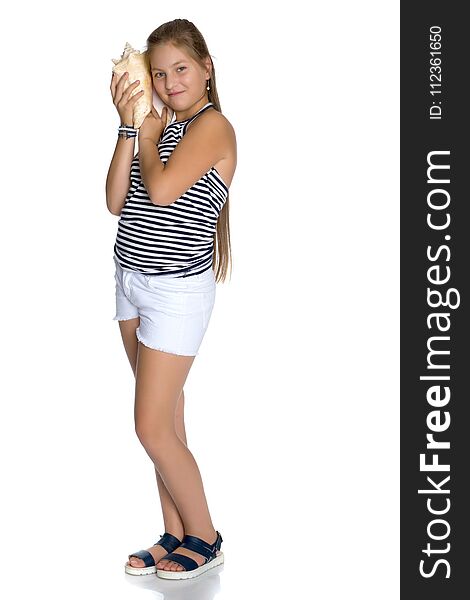 A teenage girl with a seashell. The concept of summer holidays, ecology. on white background. A teenage girl with a seashell. The concept of summer holidays, ecology. on white background.