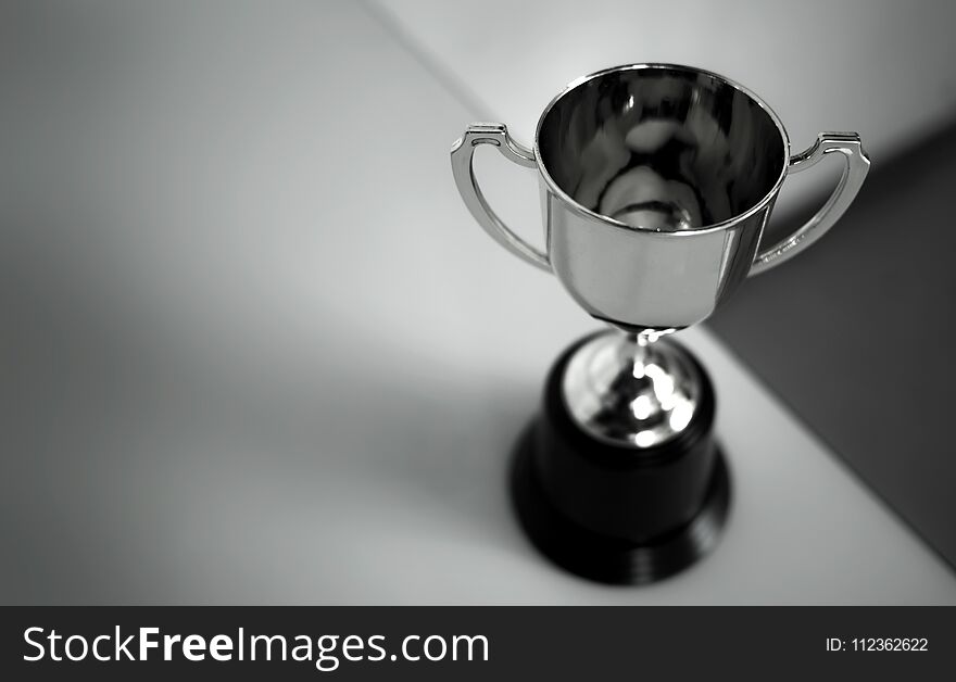 Champion Golden Trophy Placed On Table .