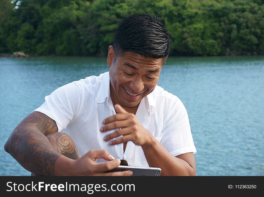 Man on seawall on vacation in Japan with white shirt 6