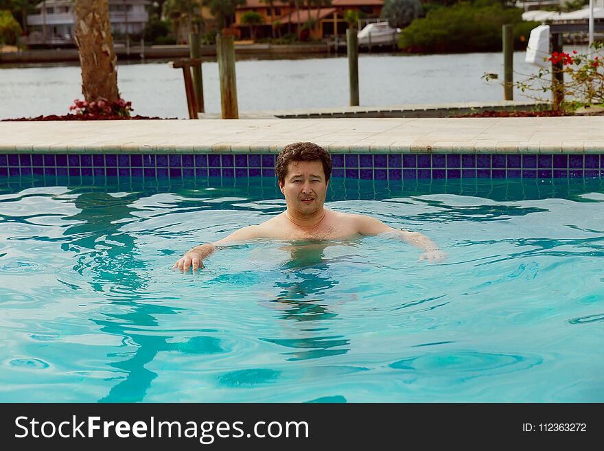 Portrait of a man swimming underwater