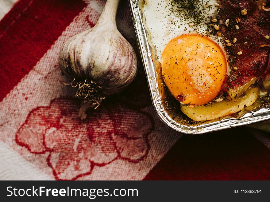 Close-up Photography Of Garlic And Egg Yolk