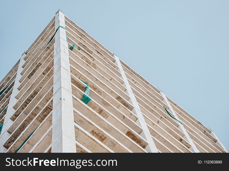 Low Angle Photography of Beige Concrete Building