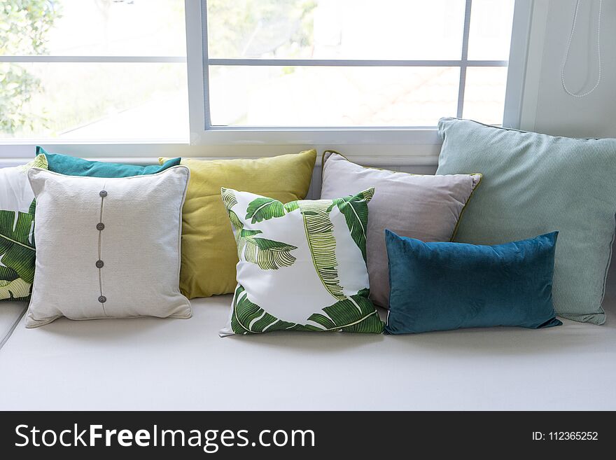 Close up of colorful pillows on sofa in modern living room