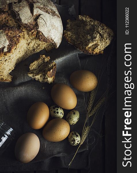 Loaf Of Rye Bread With Chicken Eggs In Wooden Box