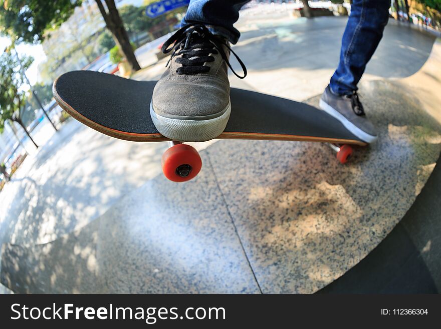 Skateboarder Legs Riding Skateboard