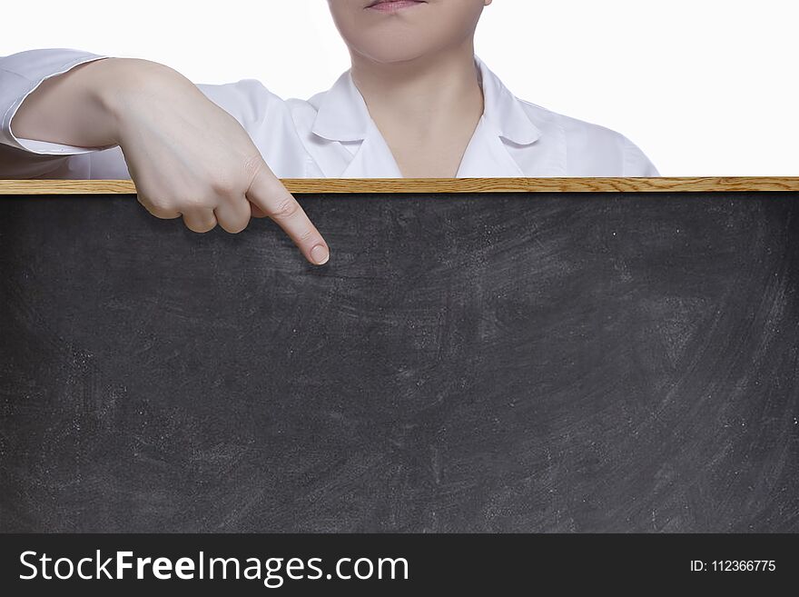 A female doctor points a finger at the blackboard. A female doctor points a finger at the blackboard