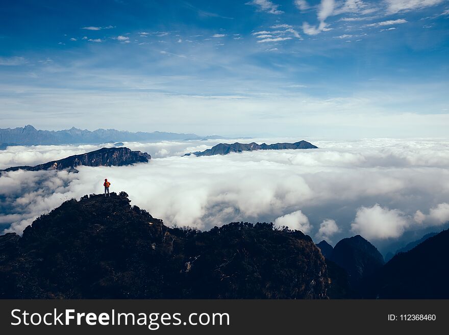 Successful hiker in the beautiful landscape on mountain top