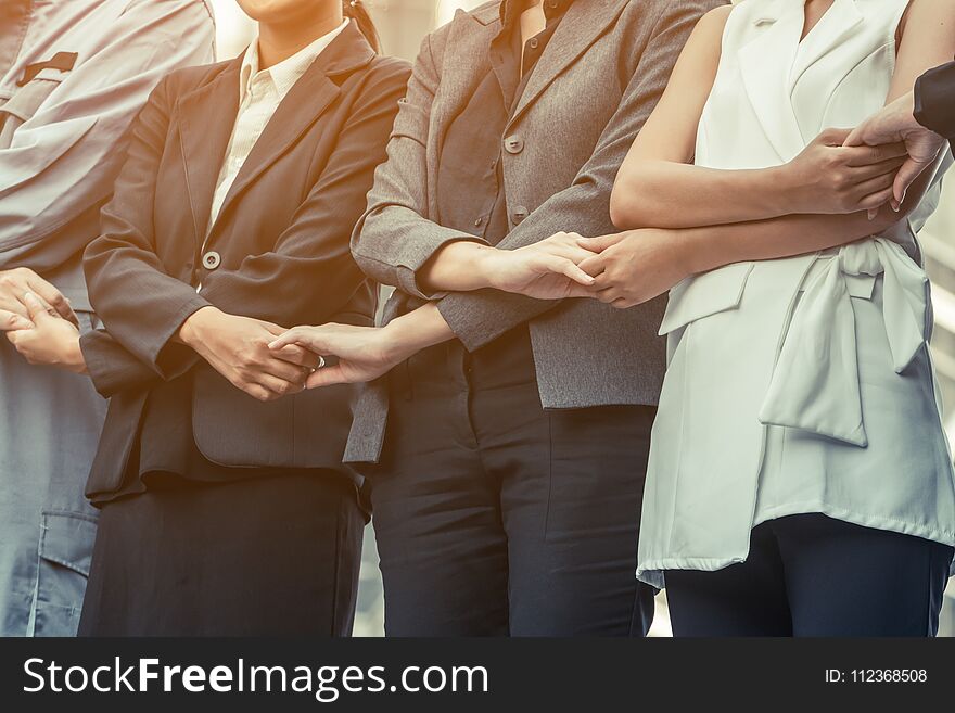 Business people holding hands together showing teamwork, people unity, corporate for businesses success. Business people holding hands together showing teamwork, people unity, corporate for businesses success.