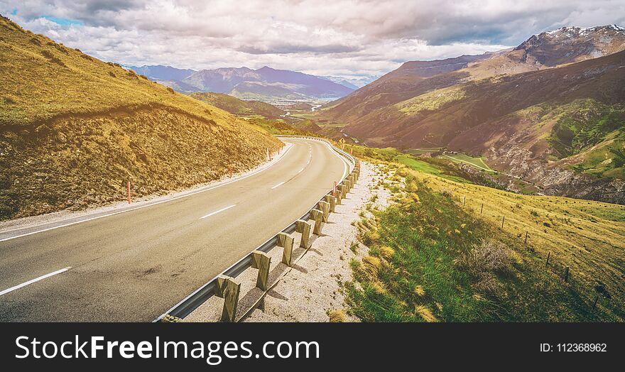 Winding empty road on the mountain with nature landscape background.