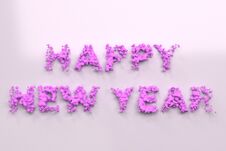 Liquid Violet Happy New Year Words With Drops On White Background Stock Photography