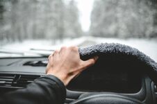 Hand On The Helm. Driving In The Winter Forest Stock Photos