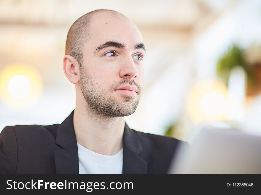 Close-up of young businessman working at cafe. Close-up of young businessman working at cafe